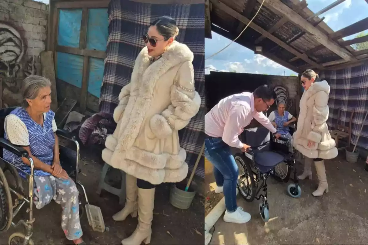 A woman in a fur coat talks to an elderly lady in a wheelchair while a man adjusts another wheelchair in a rustic setting.