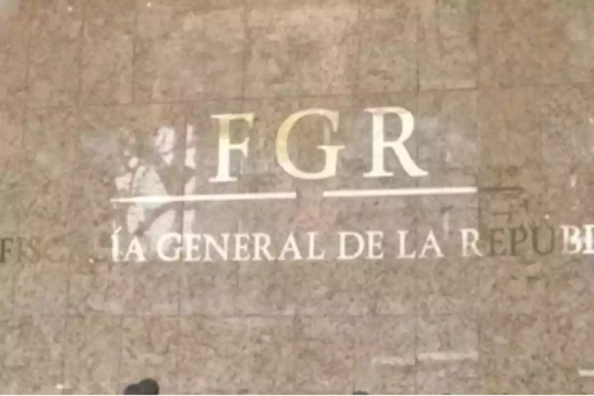 A marble wall with the letters FGR and part of the text 