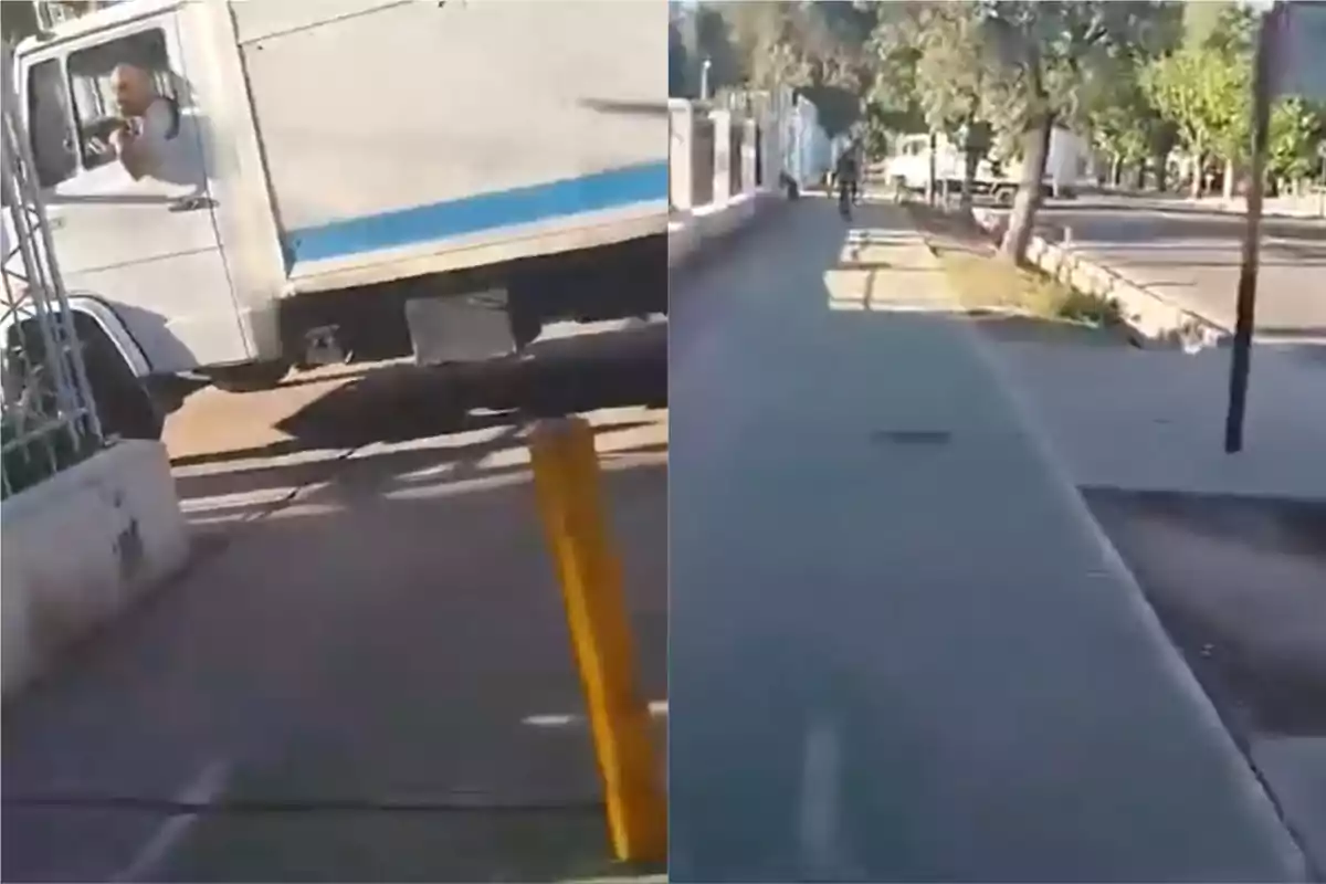 Un camión blanco circula por una calle junto a una ciclovía en un entorno urbano con árboles y una persona en bicicleta al fondo.