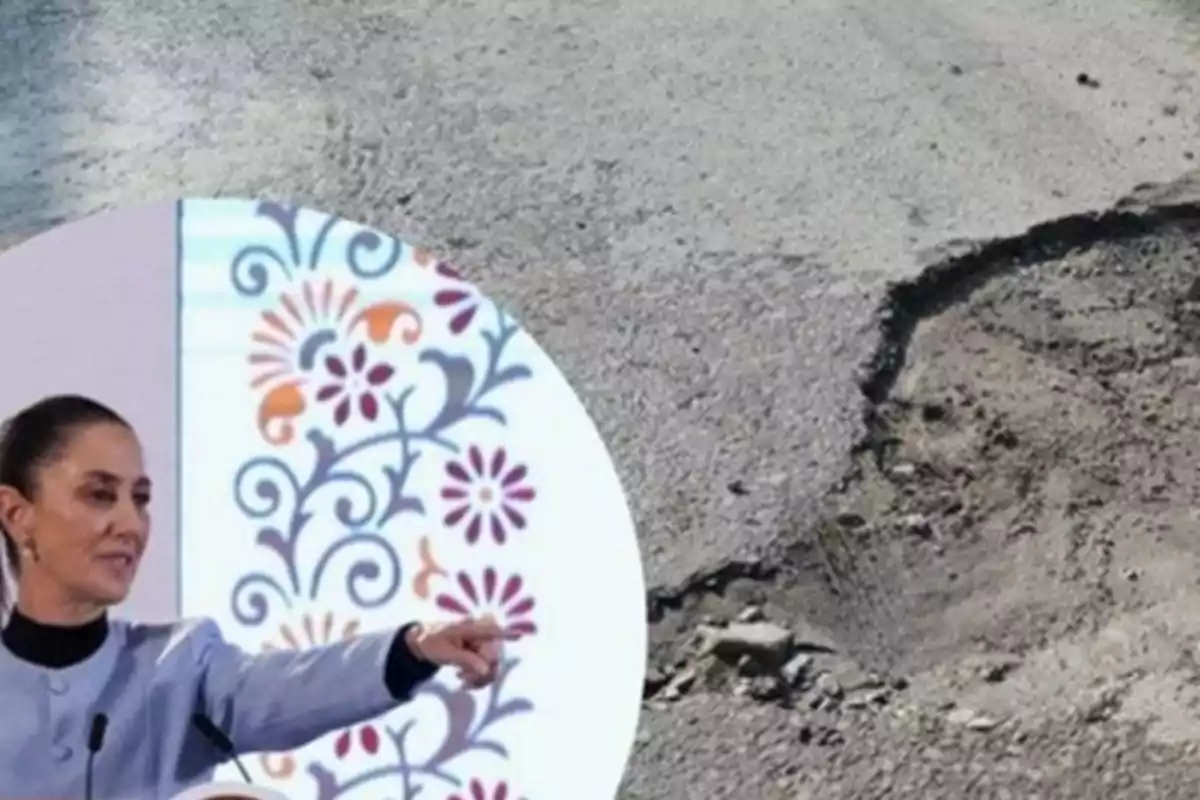 A person pointing at a pothole in a road.